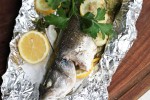 whole-fish-baked-in-a-foil-parcel-ever-open-sauce image