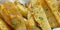 how-to-make-parmesan-potato-wedges-delish image