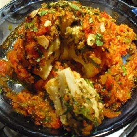 indian-spiced-roasted-whole-cauliflower-with-tomato image