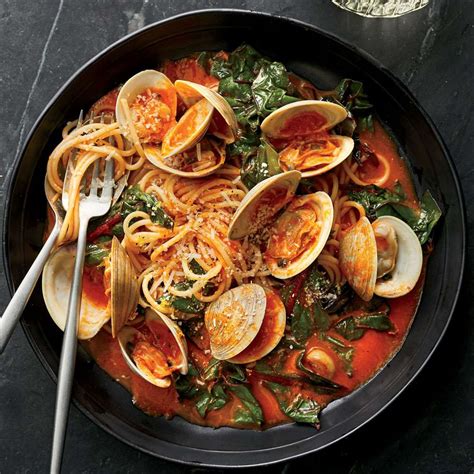 spaghetti-with-clams-and-braised-greens image