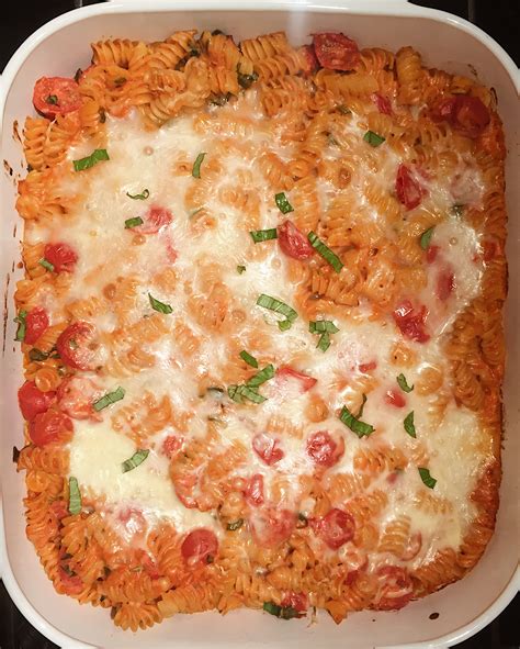 creamy-pasta-bake-with-cherry-tomatoes-and-basil image