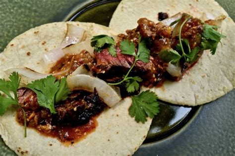 chipotle-skirt-steak-tacos-with-smoky-tomatillo-salsa image
