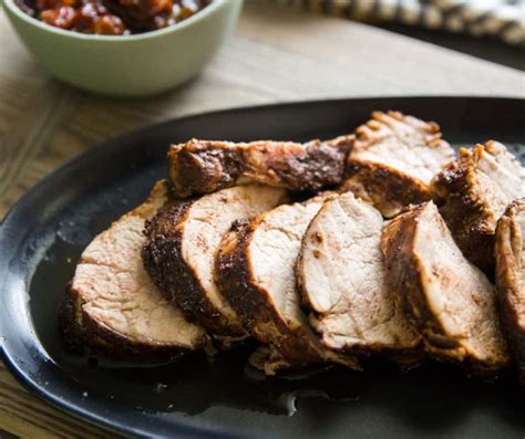 cocoa-and-chili-spiced-pork-with-cherry-sauce-lemons image