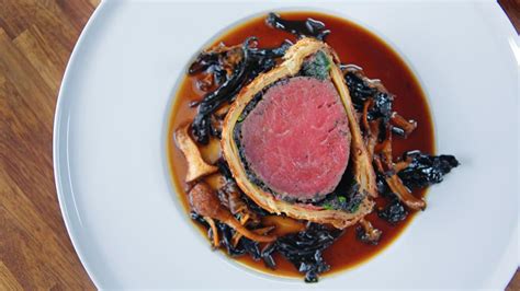 beef-wellington-with-wild-mushroom-madeira-sauce image