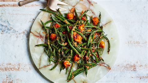 blistered-green-beans-with-tomato-almond-pesto image
