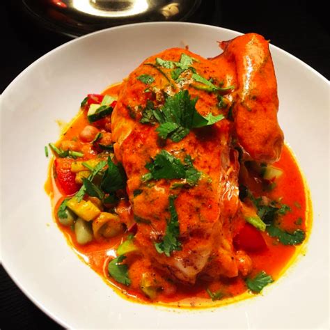 grilled-chicken-with-spicy-brazilian-tomato-coconut-sauce image