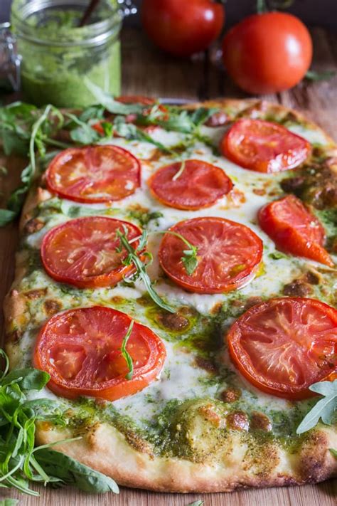 pesto-pizza-with-fresh-tomatoes-mozzarella image