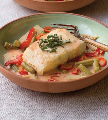 poached-halibut-in-a-coconut-curry-broth-clean-eating image