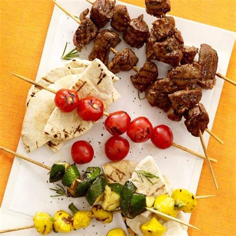 lemon-and-herb-lamb-kabobs-with-summer-vegetables image