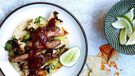 skirt-steak-fajitas-with-grilled-cabbage-and-scallions image