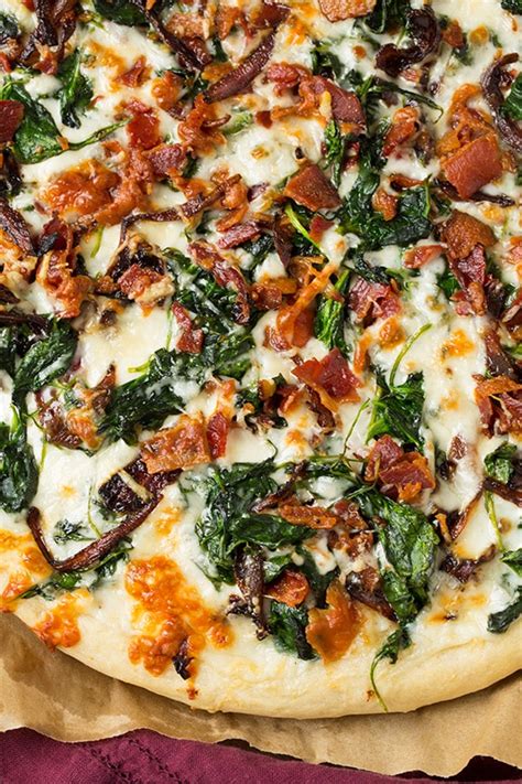 caramelized-onion-bacon-and-spinach-pizza-cooking image