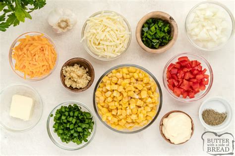 cheesy-baked-corn-dip-butter-with-a-side-of-bread image