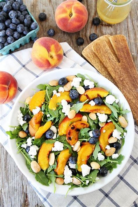 grilled-peach-blueberry-and-goat-cheese-arugula-salad image