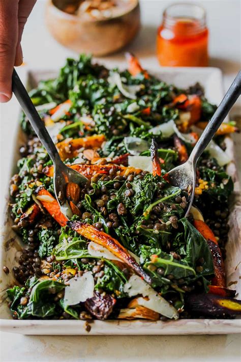 warm-lentil-and-kale-salad-with-carrot-harissa-dressing image