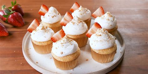 strawberry-cheesecake-stuffed-cupcakes-delish image