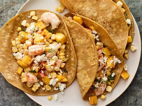 shrimp-tacos-with-mango-basil-corn-and-feta image