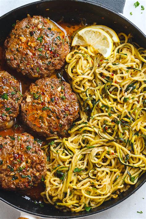 cheesy-garlic-burgers-with-lemon-butter-zucchini-noodles image