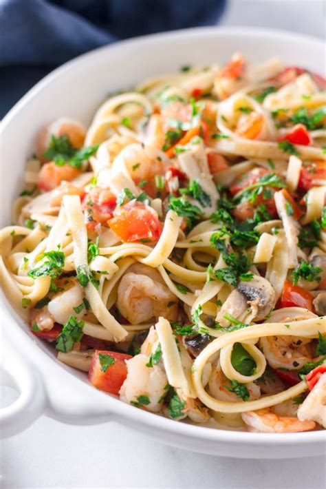 garlic-shrimp-fettuccine-with-tomatoes-and-mushrooms image