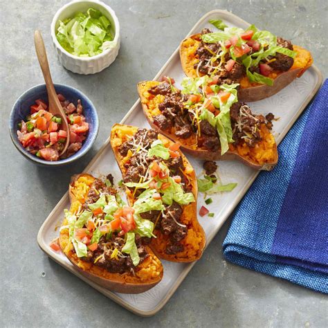 taco-stuffed-sweet-potatoes-recipe-eatingwell image