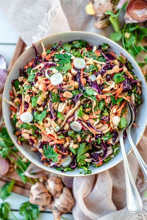 crunchy-asian-slaw-with-peanut-dressing-two-spoons image