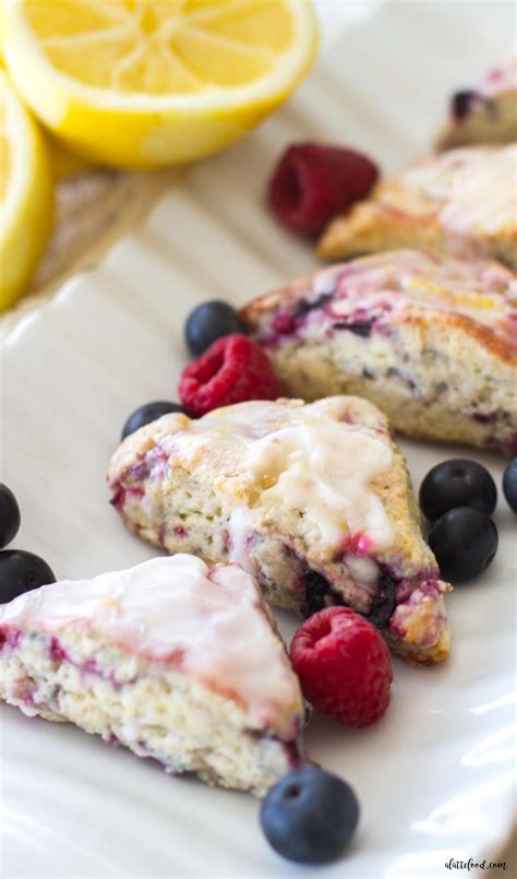 mixed-berry-scones-with-a-lemon-glaze-a-latte-food image