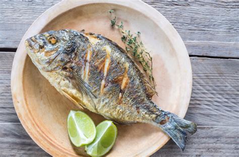 greek-style-baked-fish-with-garlic-and-vinegar image