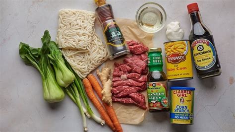 beef-and-udon-noodle-stir-fry-recipe-tasting-table image