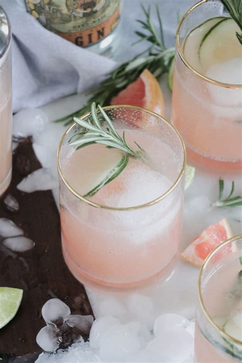 grapefruit-gin-fizz-cocktail-with-rosemary-garnish image