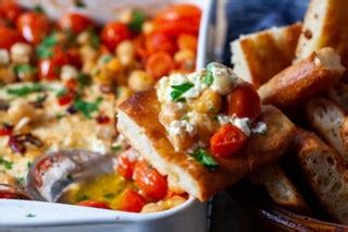 baked-feta-with-tomatoes-and-chickpeas-smitten-kitchen image