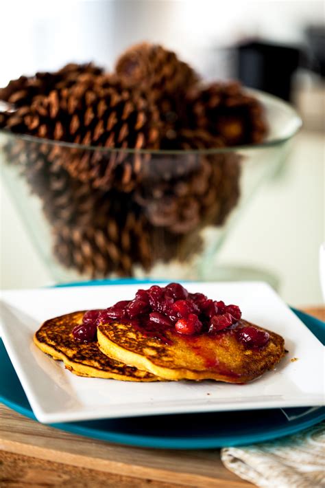 persimmon-cornmeal-pancakes-with-maple-cranberry image