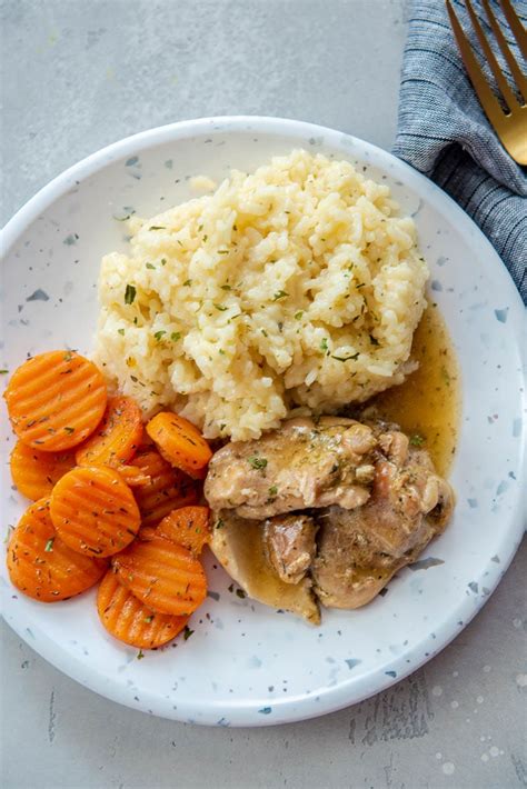 instant-pot-chicken-thighs-with-gravy-garnished-plate image