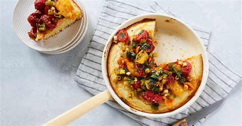 buttermilk-skillet-cornbread-with-tomatoes-and-scallions image