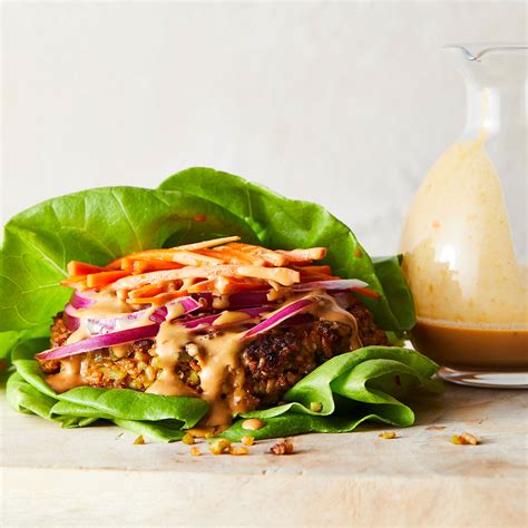 edamame-lettuce-wrap-burgers-with-peanut-sauce image