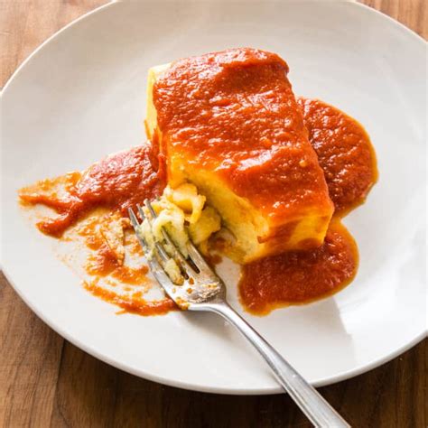 fluffy-baked-polenta-with-red-sauce-cooks-country image