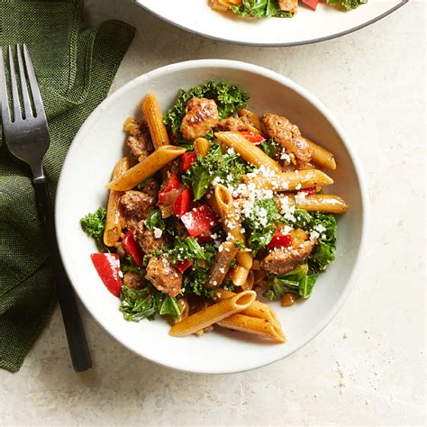 sausage-kale-pasta-with-peppers-eatingwell image