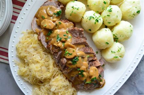 polish-feast-roasted-pork-potato-dumplings-sauerkraut image