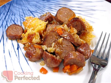 sausage-casserole-with-a-cheesy-rice-topping-cooking-perfected image