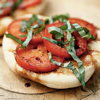 grilled-flatbreads-with-tomatoes-and-basil-recipe-myrecipes image