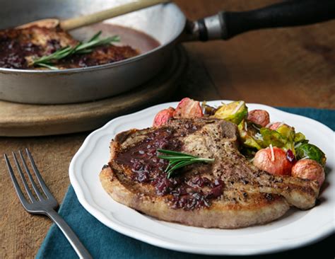 skillet-pork-chops-with-red-wine-and-rosemary-reduction image