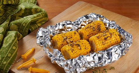 oven-roasted-parmesan-corn-on-the-cob-daily-delish image