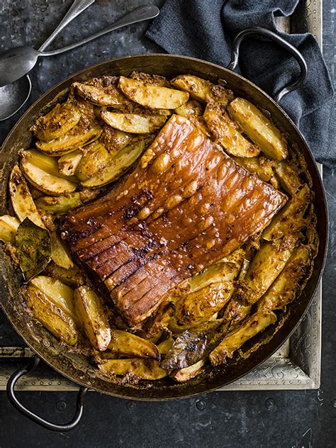 roast-pork-belly-recipe-with-potatoes-baked-in-milk image