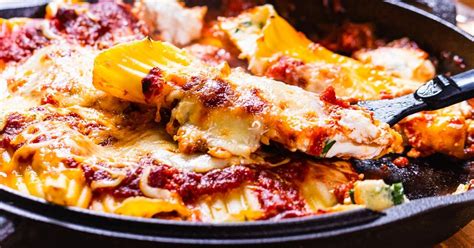 creamy-four-cheese-baked-manicotti-sip-and-feast image