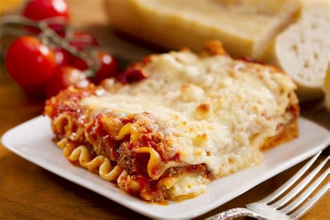 lasagna-recipe-with-white-and-red-sauce-the-spruce image