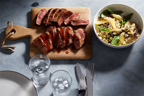 harissa-rubbed-lamb-with-pistachio-currant-and-lemon image