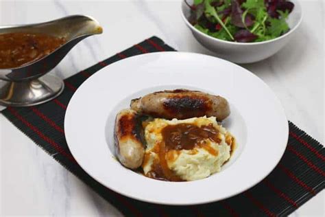 bangers-and-mash-with-onion-gravy-delicious-british image