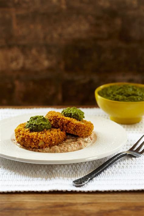 curried-millet-cakes-with-red-pepper-coriander-sauce image