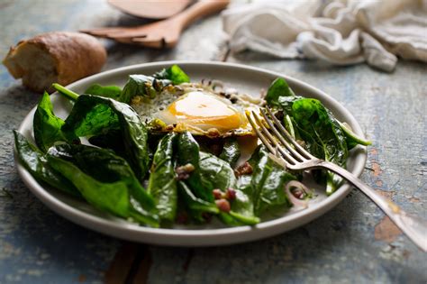 a-warm-spinach-salad-wearing-pancetta-and-egg-the image