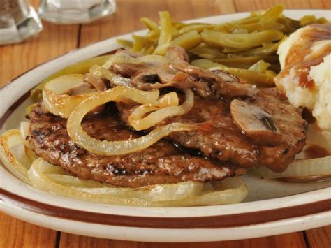 classic-hamburger-steak-with-onions-and-gravy image