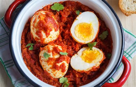 fried-hard-boiled-eggs-in-spicy-tomato-sauce image