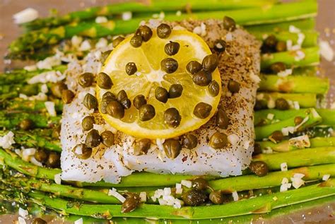 baked-cod-and-asparagus-with-garlic-lemon-caper-sauce image